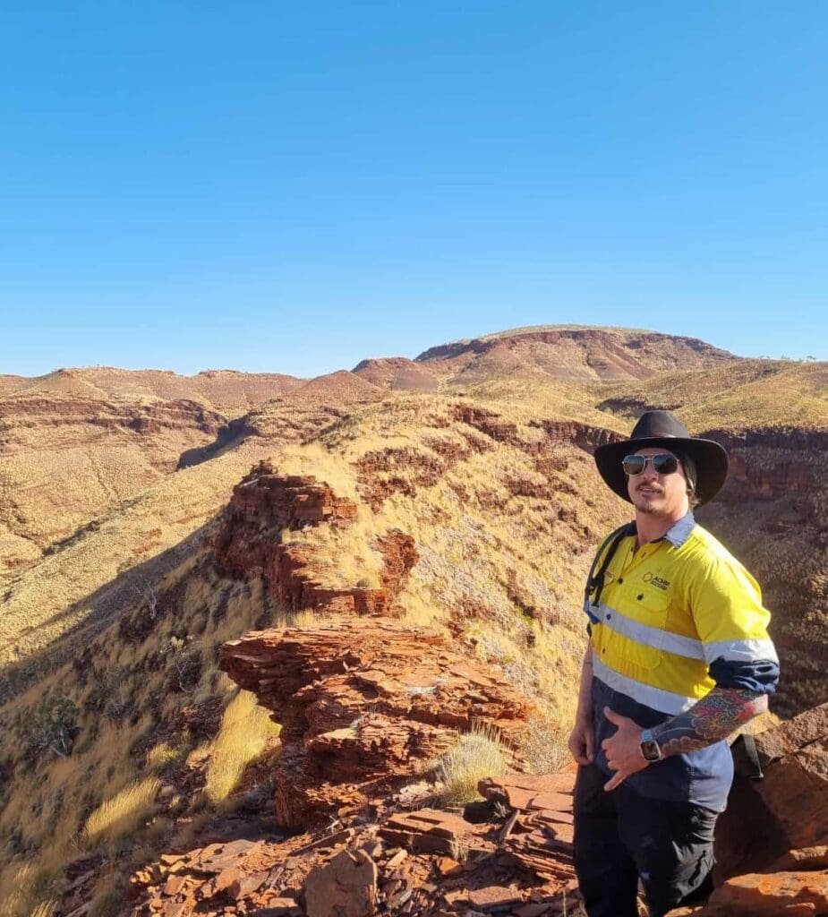 ACHM staff member standing on mountain ridge