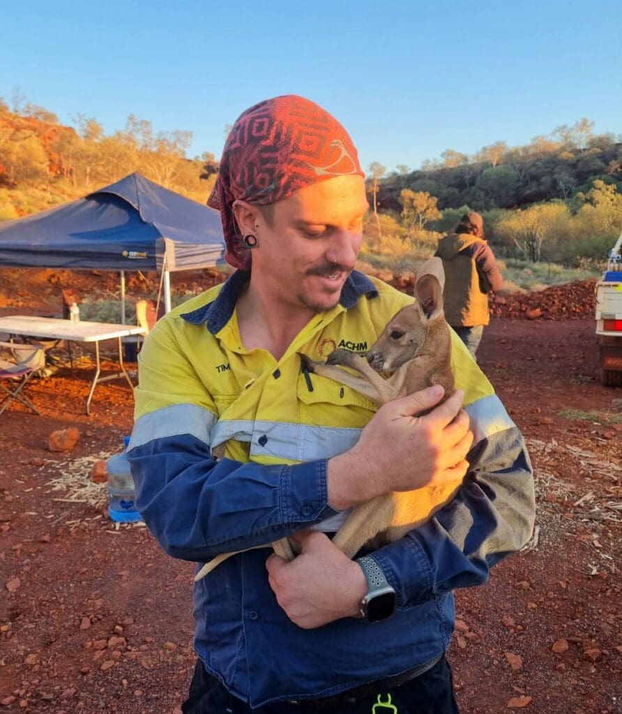 ACHM staff member holding a baby kangaroo